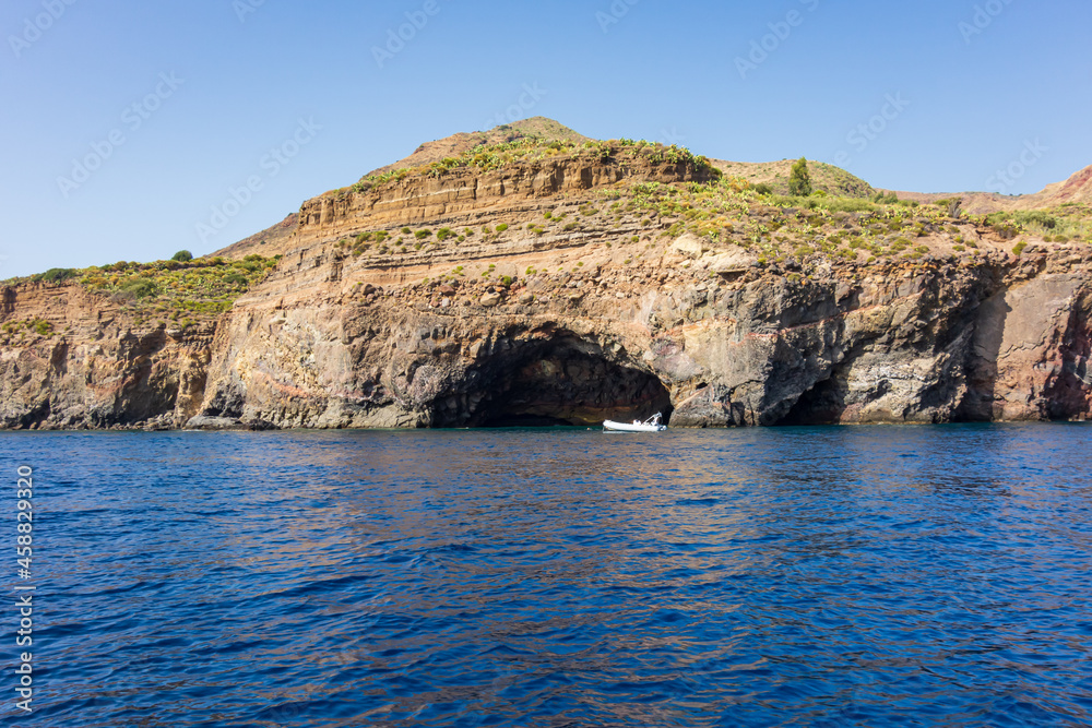 Lipari island (Aeolian archipelago), Messina, Sicily, Italy: view of the seacoast with caves.