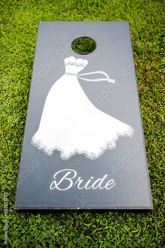 Corn hole board saying bride. 