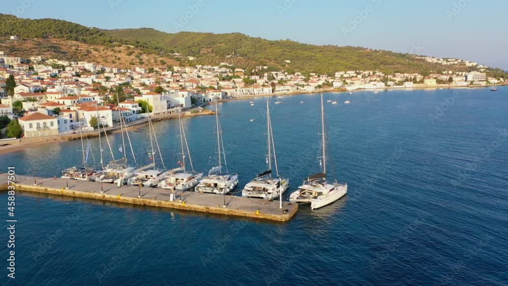 Catamaran and sail Yachts anchored at Spetses marina seaport. Greece Catamaran and sail Yachts anchored at Spetses marina seaport. Greece