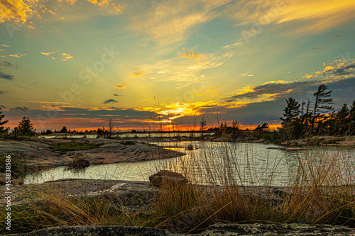 Photography Sundown  on a rocky shore at sunset in Northern Georgian Bay (Lake Huron) Ontario Canada