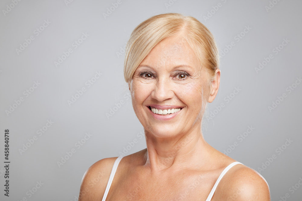 Portrait of beautiful blond senior woman posing and looking at the camera. Beauty photography Portrait of beautiful blond senior woman posing and looking at the camera. Beauty photography