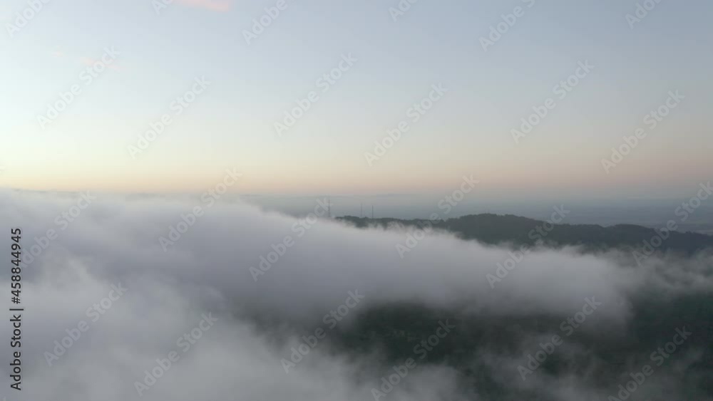 Smooth drone tracking right following clouds above beautiful natural landscape below. Smooth drone tracking right following clouds above beautiful natural landscape below.