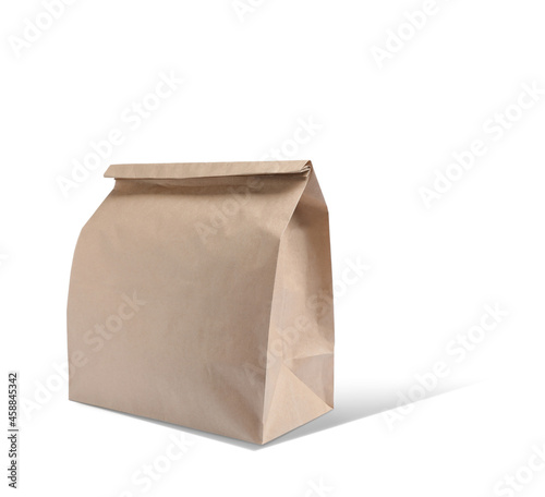 New closed paper bag on white background