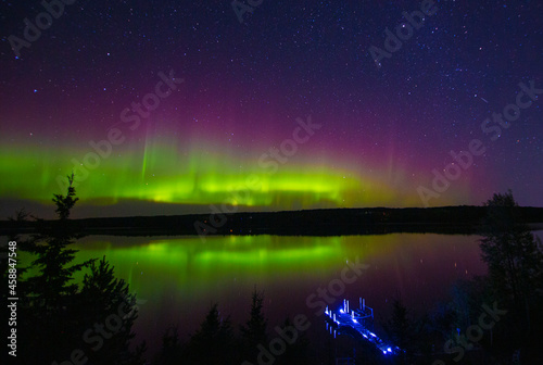 Northern Lights in Canada reflecting on a lake