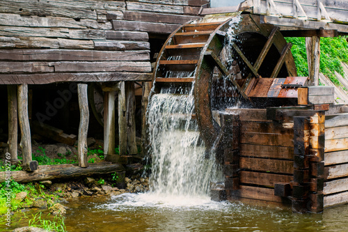 Old water mill, mill wheel on the river