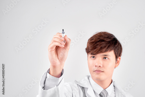 asian medical doctor write on imaginary panel