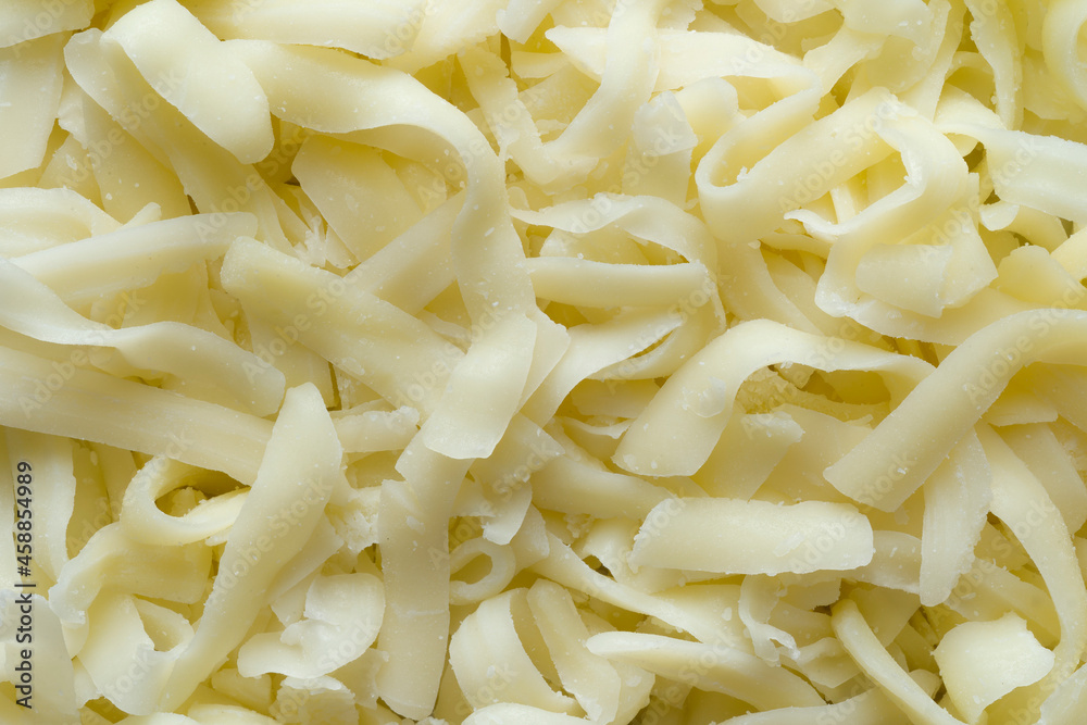 thick cut grated mozzarella cheese food background