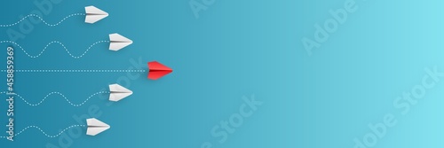 Individual red leader paper plane lead other on blank copy space background. Business and leadership concept