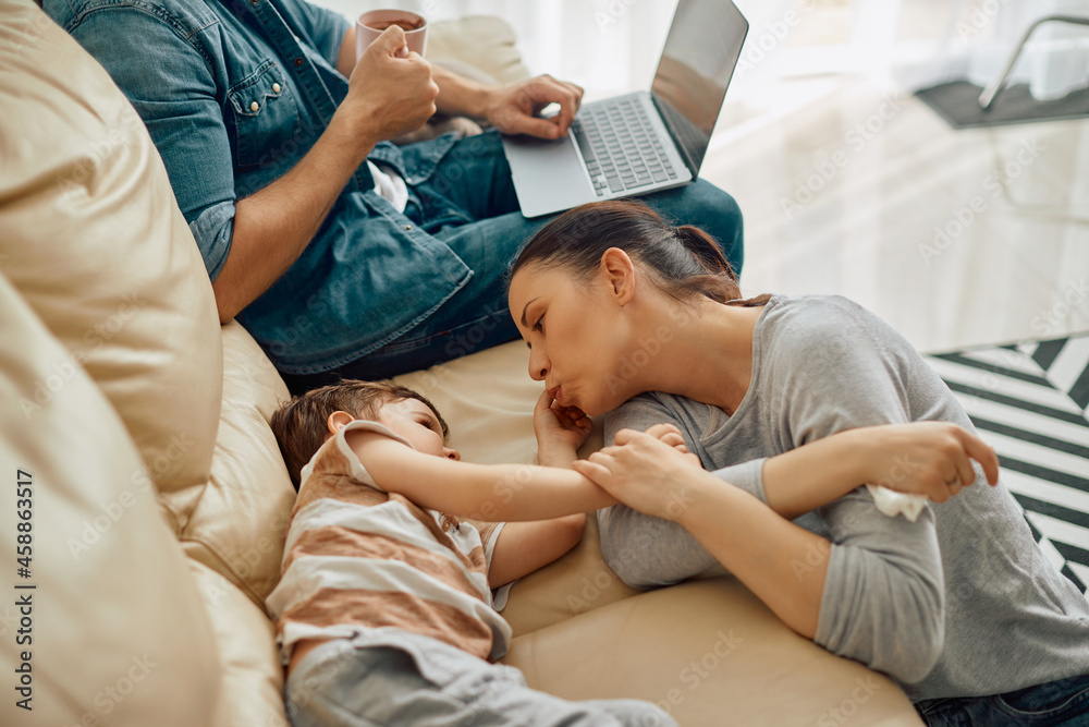 Affectionate mother enjoys in time with her small son at home.