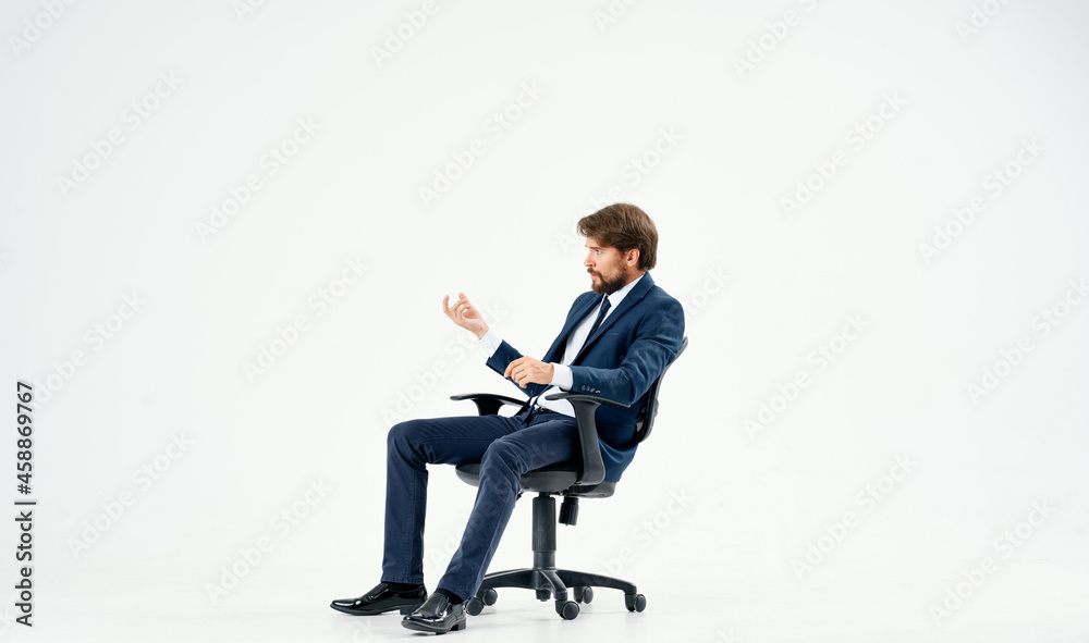 business man in a suit sitting in a chair emotions studio business man in a suit sitting in a chair emotions studio