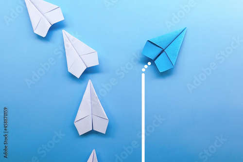 blue paper plane is leadership with white paper plane.leadership concept