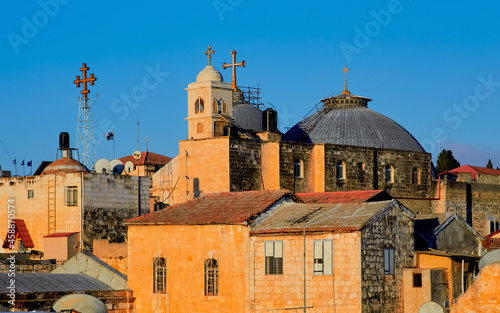 sunrise over Domes of the Church of the Holy Sepulcher and the ancient rooftops of the old city of jerusalem, israel