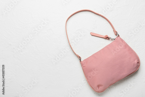 Stylish handbag on white background