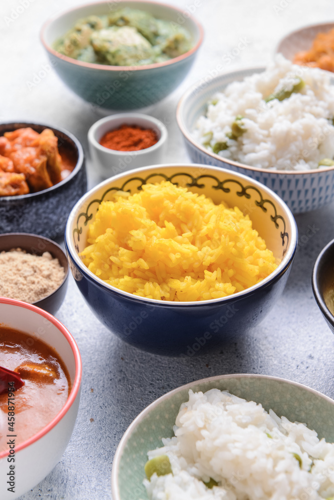Traditional Indian food and spices on grey background Traditional Indian food and spices on grey background