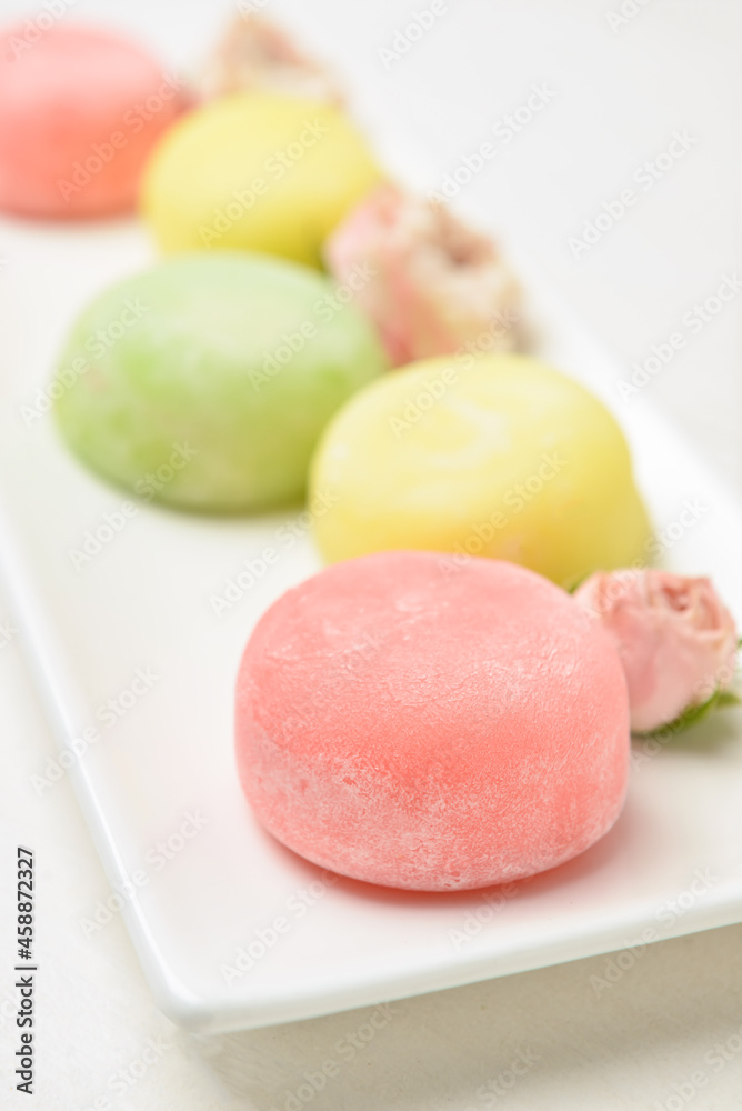 Plate with tasty Japanese mochi and flowers, closeup Plate with tasty Japanese mochi and flowers, closeup