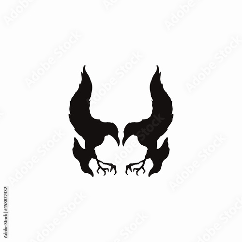 向かい合わせの二羽のカラスで悪魔を表現した、ロゴ、アイコンデザインのためのシルエットイラスト