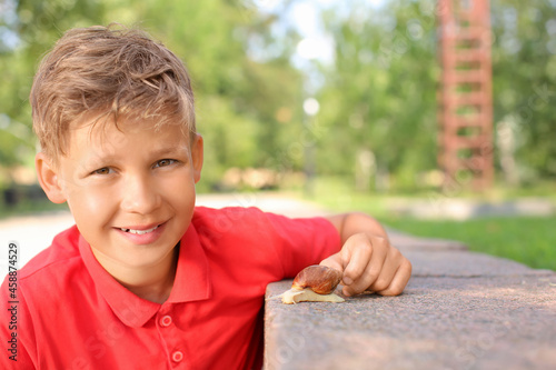 Little boy with achatina sn...