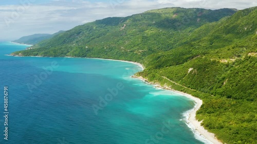 The road through mountains to blue Caribbean sea landscape. Rainforest in the Caribbean mountains. Nature Barahona Dominican Republic. photo