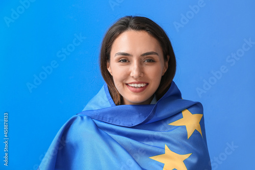 Young woman with flag of Eu...