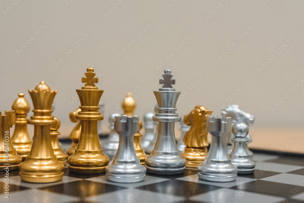 Closeup of chess characters on board games. to represent decision making in term of business strategy to find out the best solution to meet target objective and goal.