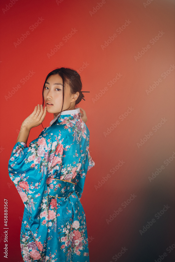Japanese woman in traditional kimono in studio Japanese woman in traditional kimono in studio