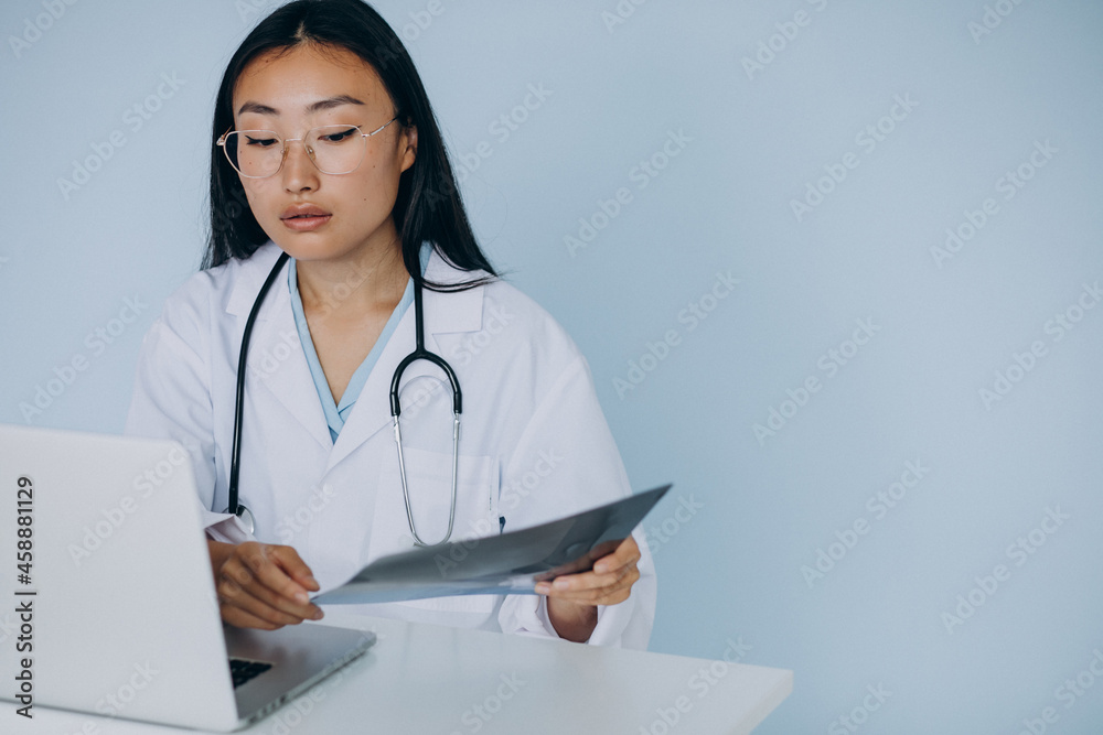 Woman doctor watching fracture on computer programme Woman doctor watching fracture on computer programme