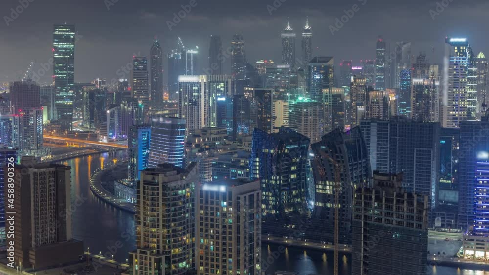 Skyline with modern architecture of Dubai business bay towers night timelapse. Aerial view Skyline with modern architecture of Dubai business bay towers night timelapse. Aerial view