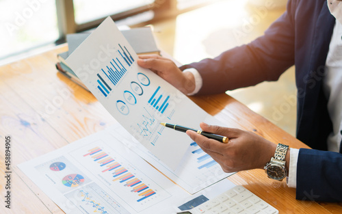 Close up view of bookkeeper or financial inspector hands making report, calculating or checking balance. Home finances, investment, economy, saving money or insurance concept.