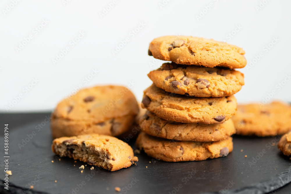 Fresh crispy chocolate cookies on a dark table Fresh crispy chocolate cookies on a dark table