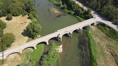 Aerial view of Nineteenth-century bridge over the Yantra River, known as the Kolyu Ficheto Bridge in Byala, Ruse region, Bulgaria photo