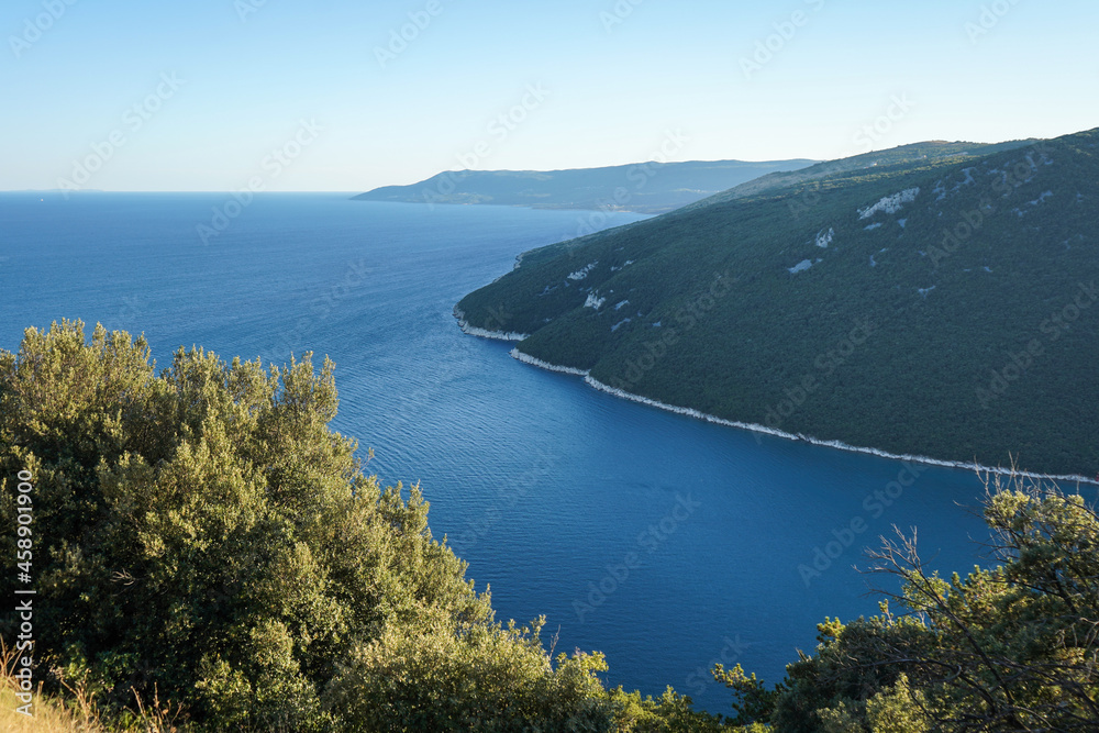 Panoramic view of Plomin bay in Istrian part of Croatia with amazing blue water and green woods on hills