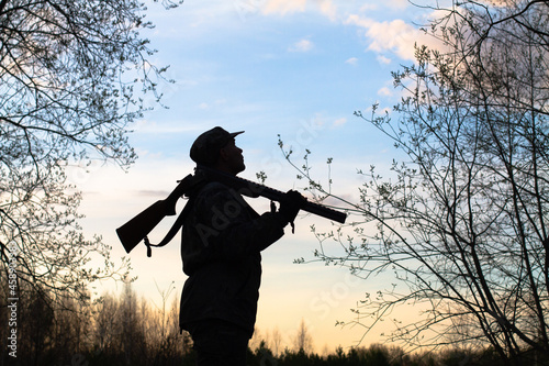 the hunter looks at the evening sky