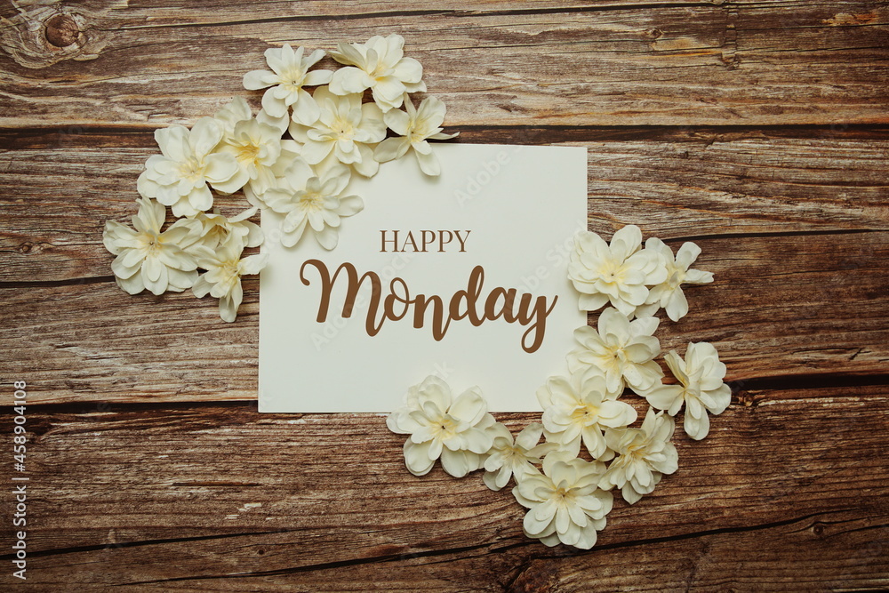 Happy Monday card typography text with flower bouquet on pink background Happy Monday card typography text with flower bouquet on pink background