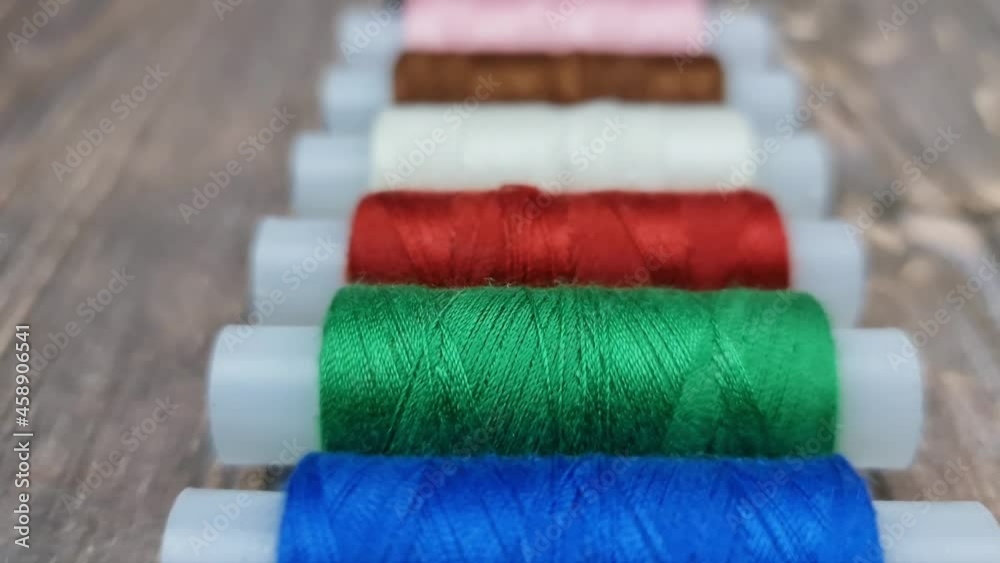 The Multicolored sewing threads. A set of sewing threads. The Multicolored sewing threads. A set of sewing threads.
