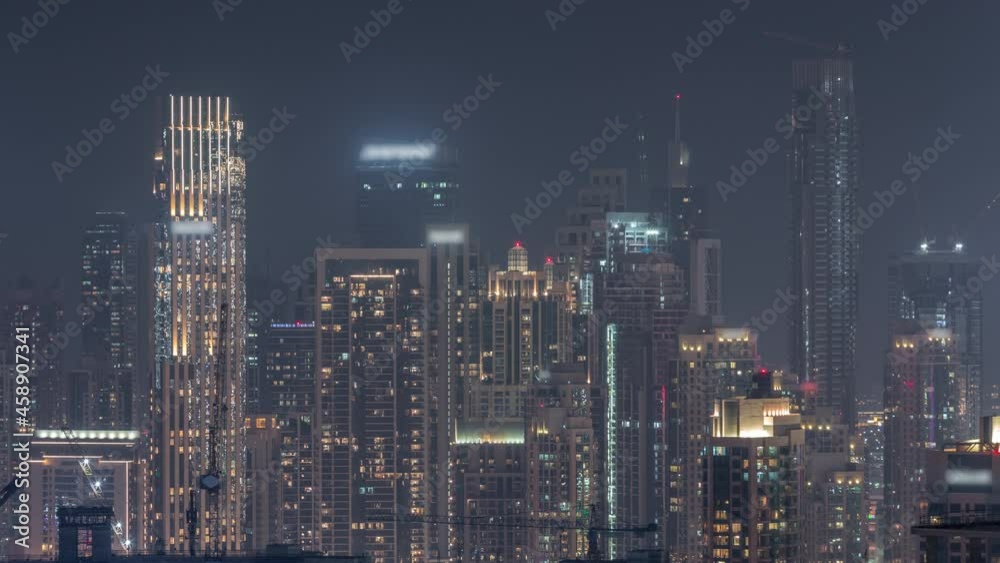 Panoramic skyline of Dubai with business bay and downtown district night timelapse. Panoramic skyline of Dubai with business bay and downtown district night timelapse.