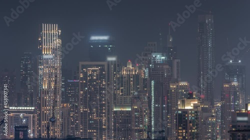 Wallpaper Mural Panoramic skyline of Dubai with business bay and downtown district night timelapse. Torontodigital.ca