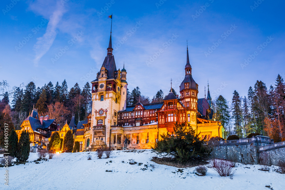 Peles Castle in winter at dusk . Sinaia, Prahova county, Romania.