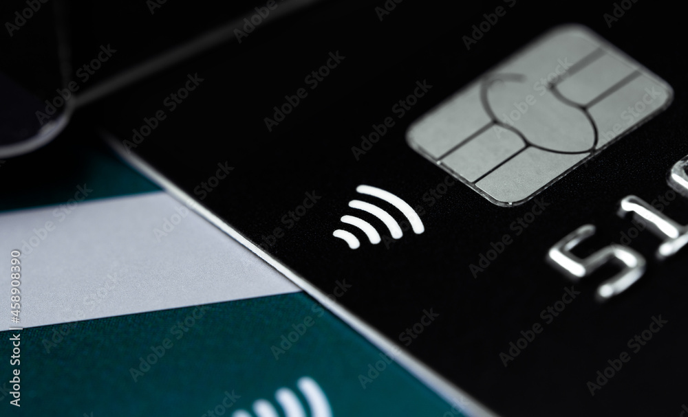 bankcard with metal electronic EMV chip, RFID contactless payment, closeup macro bankcard with metal electronic EMV chip, RFID contactless payment, closeup macro