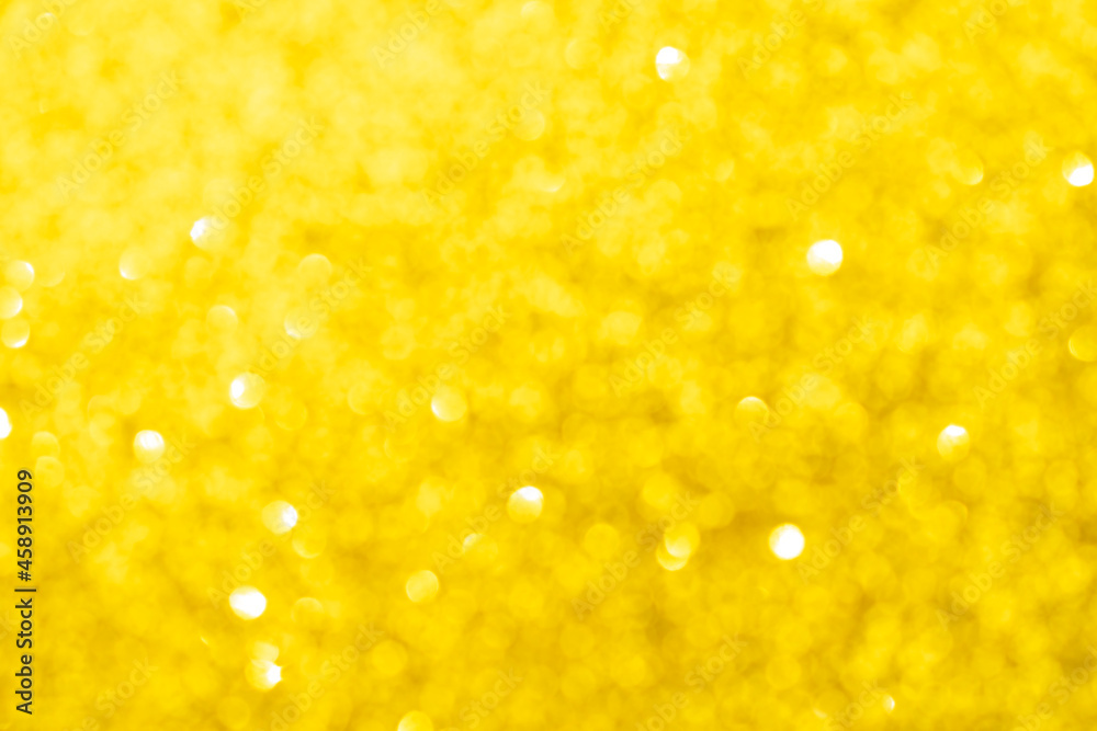 Abstract golden yellow blurred bokeh background. Glitter shining lights. Festive and celebration backdrop for holiday, christmas and new year design, stock photo Abstract golden yellow blurred bokeh background. Glitter shining lights. Festive and celebration backdrop for holiday, christmas and new year design, stock photo