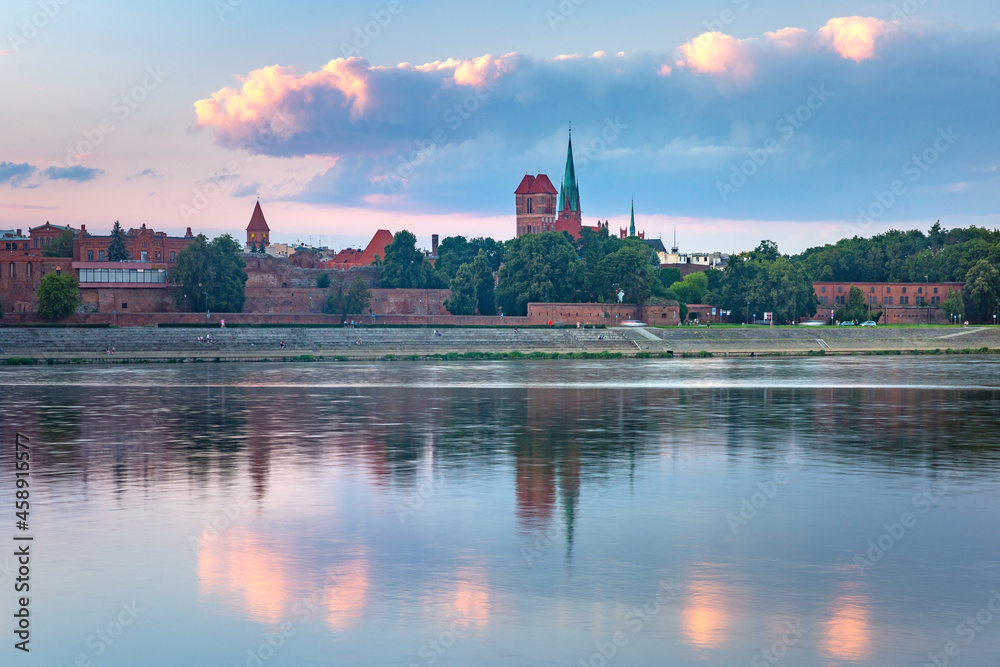 Panorama of Old Town of Torun seen from the Vistula at sunset, Poland