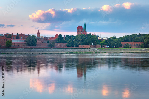 Panorama of Old Town of Torun seen from the Vistula at sunset, Poland