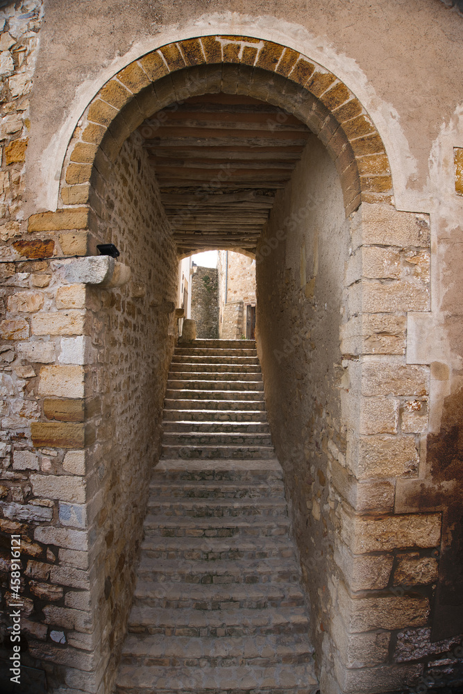 Stairs under an arch in the medieval town of Culla (Castellon, Spain)
