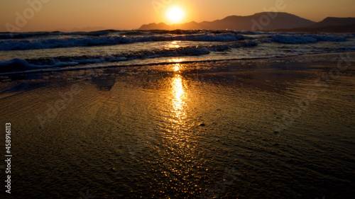 Spawning place of Caretta Caretta turtles  Iztuzu beach. Golden sun rays reflecting off the sea at sunset. Spectacular sunset at the meeting point of the Mediterranean and Aegean.