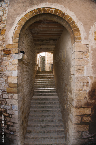 Stairs under an arch in the medieval town of Culla (Castellon, Spain)