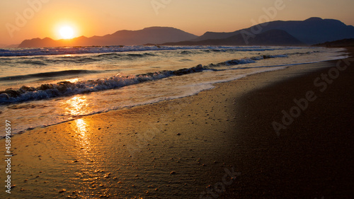 Fototapeta Naklejka Na Ścianę i Meble -  Spawning place of Caretta Caretta turtles: Iztuzu beach. Golden sun rays reflecting off the sea at sunset. Spectacular sunset at the meeting point of the Mediterranean and Aegean.