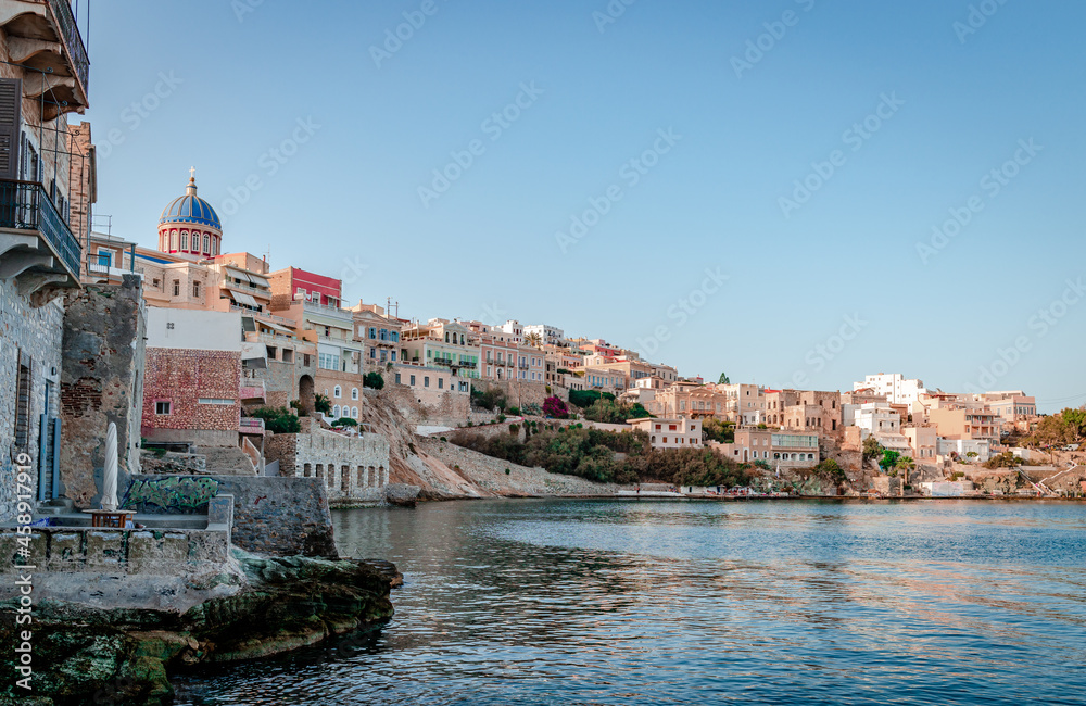 View of the historic Vaporia district in Ermoupoli, with the dome of St Nicholas in the background. Syros island, Cyclades, Greece.