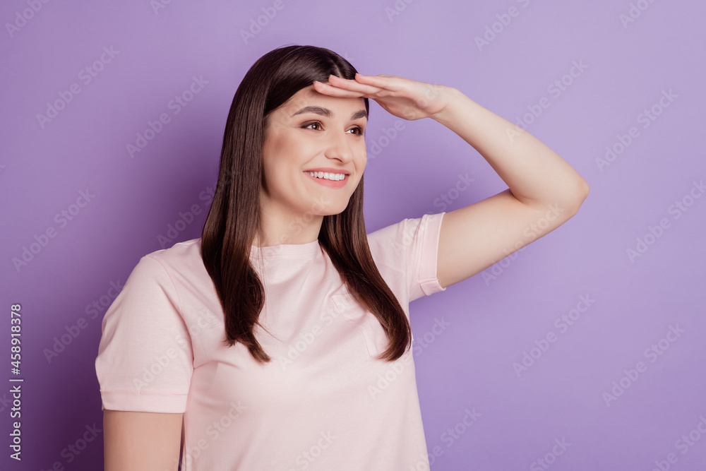 Portrait of lovely cute traveler positive lady hand forehead watch away blank space on purple background Portrait of lovely cute traveler positive lady hand forehead watch away blank space on purple background