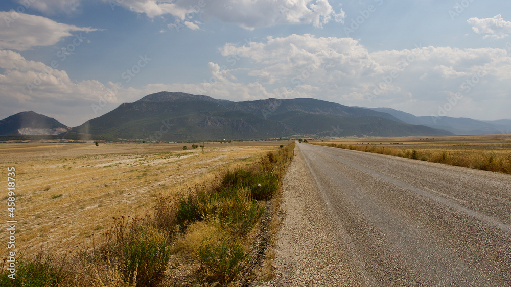 A deserted highway in the Anatolian steppe. Mine site and highway.