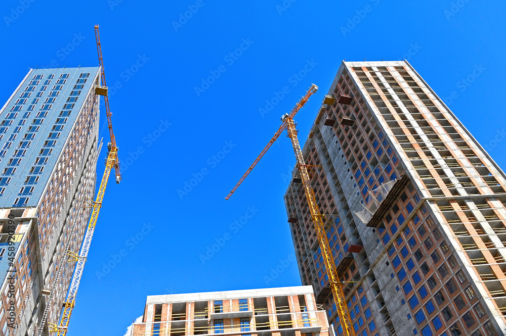 Crane and highrise construction site Crane and highrise construction site