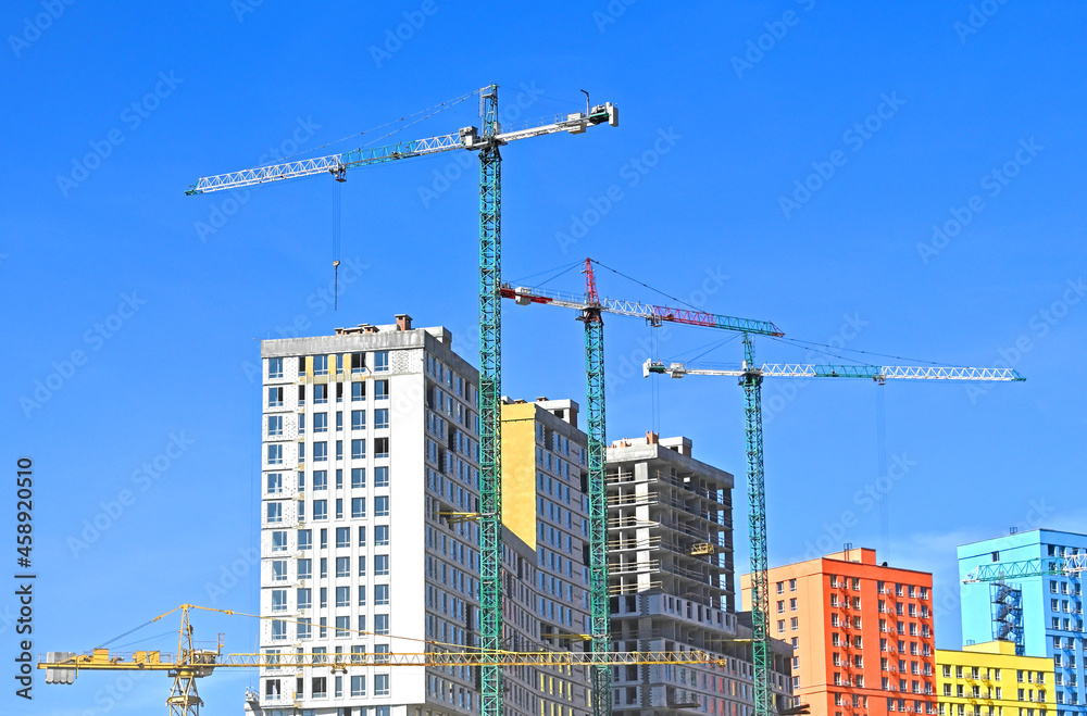 Crane and highrise construction site Crane and highrise construction site